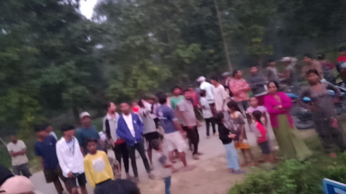 Group of people outside suresh's home.jpeg